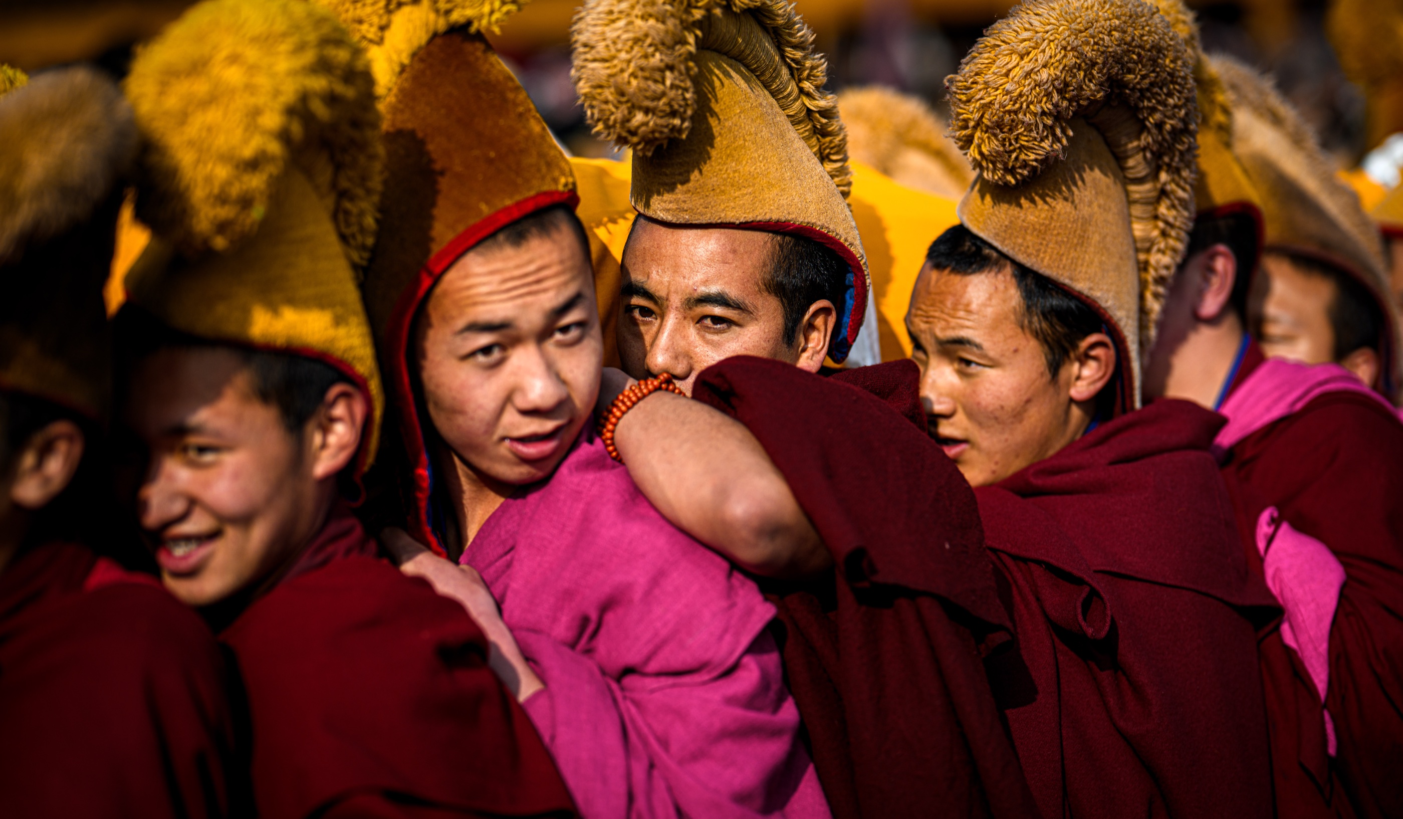 Young monks within the tightly packed procession